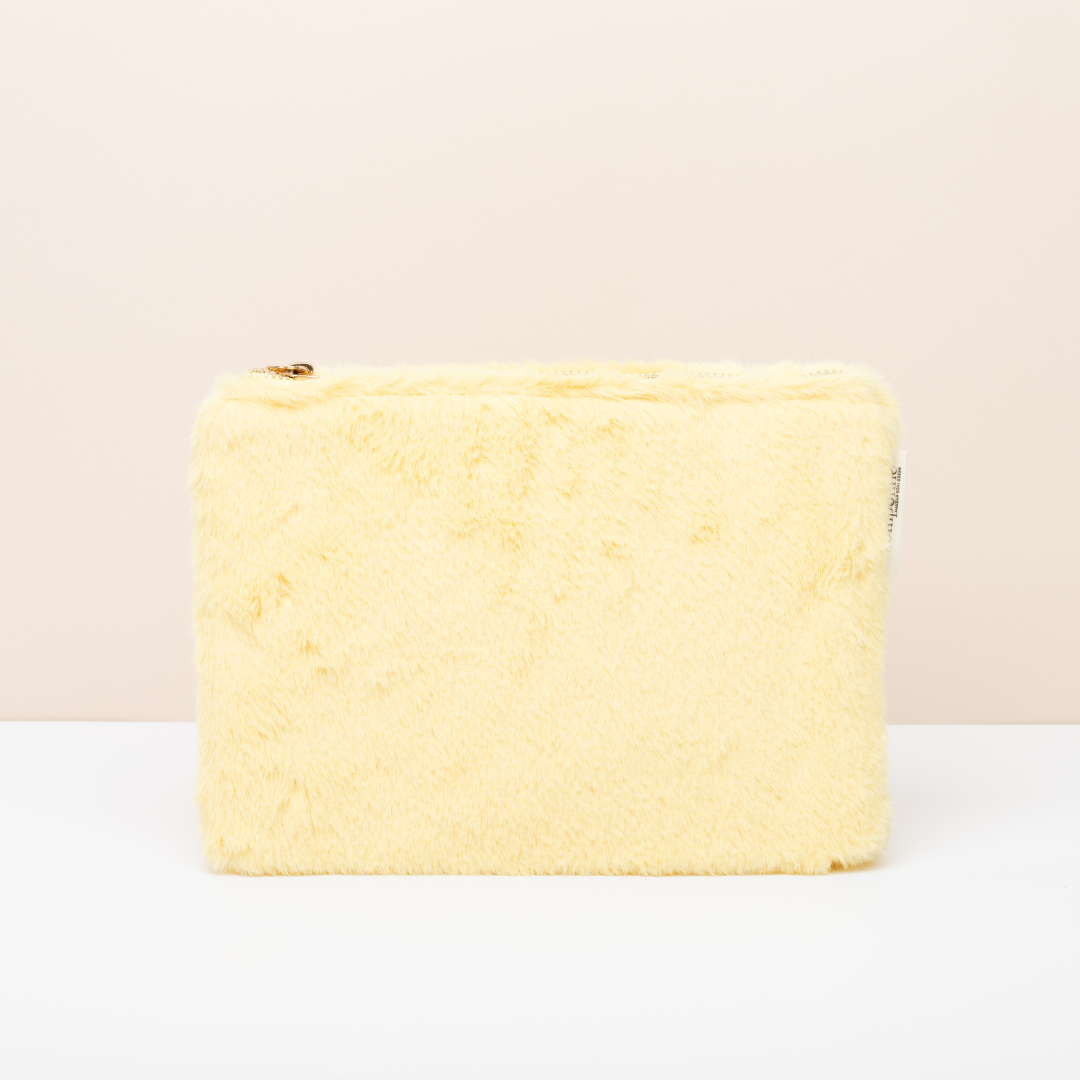 La Trousse fourrure jaune Pomponne